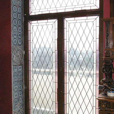 Ornament on window frame with mosaic glass